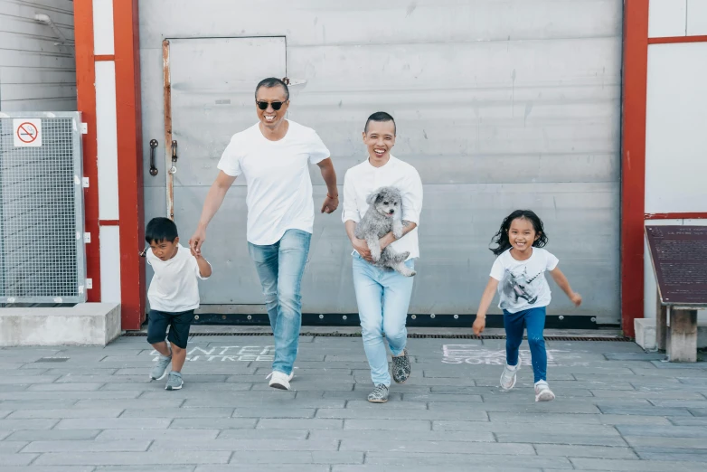 a man walking with two children and a dog, pexels contest winner, antipodeans, an all white human, zeen chin and farel dalrymple, tyler edlin and natasha tan, smiling playfully