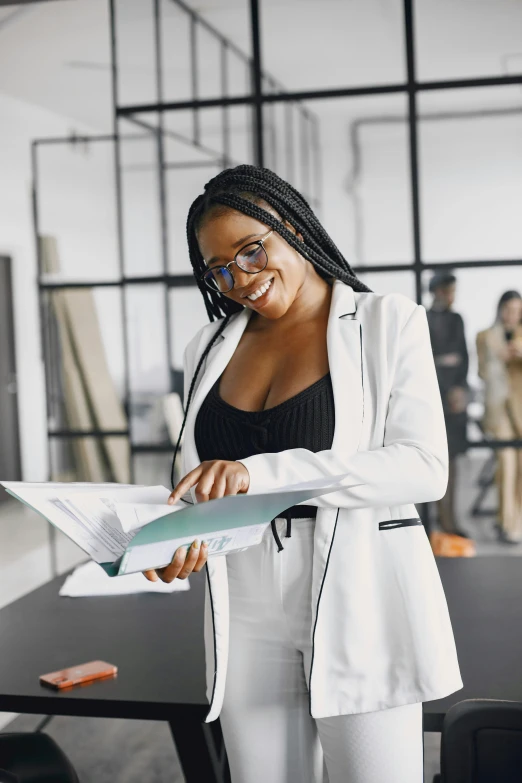 a woman talking to a man in an office, pexels contest winner, renaissance, nerdy black girl super hero, holding a clipboard, model standing pose, wearing white suit and glasses