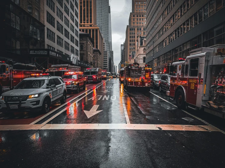 a street filled with lots of traffic next to tall buildings, pexels contest winner, hyperrealism, firefighter, manhattan, thumbnail, wet floors