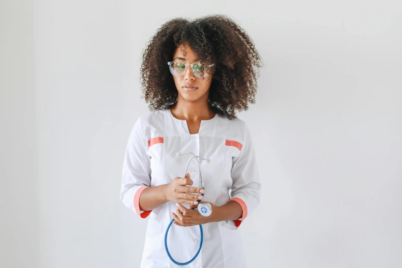a woman in a lab coat holding a stethoscope, pexels, afrofuturism, curly afro, girl wearing uniform, wavy long black hair and glasses, close - fitting nurse costume