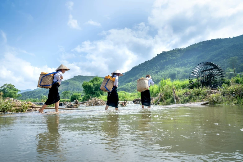 a group of people walking across a river, rice, bao phan, avatar image