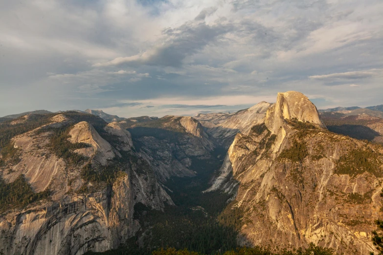 a view of the mountains from the top of a mountain, by Randall Schmit, unsplash contest winner, renaissance, yosemite valley, geology, summer evening, 2022 photograph