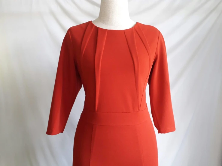 a dress on a mannequin mannequin mannequin mannequin mannequin mannequin mannequin mannequin, by Andrée Ruellan, cropped wide sleeve, dark orange, 9 0 s, vermilion