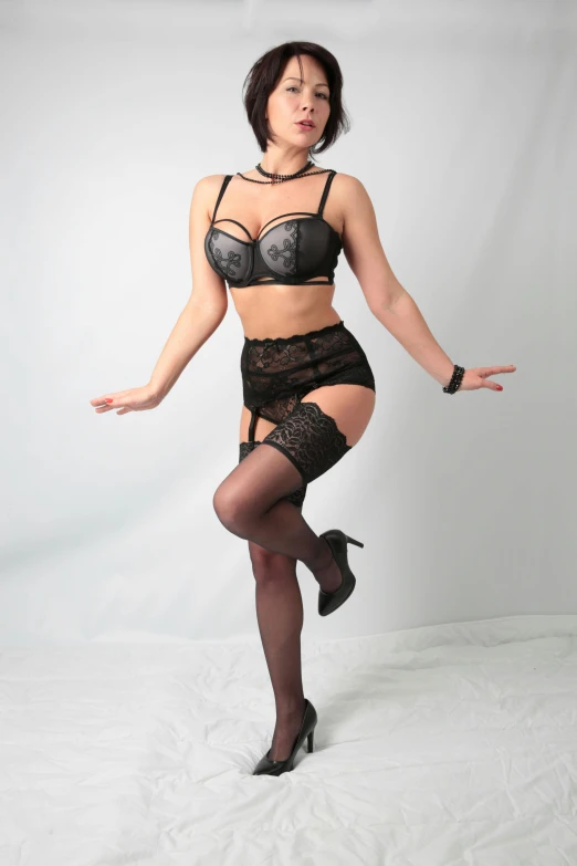 a woman in lingerie posing for a picture, very excited, knees upturned, with a walking cane, half body cropping