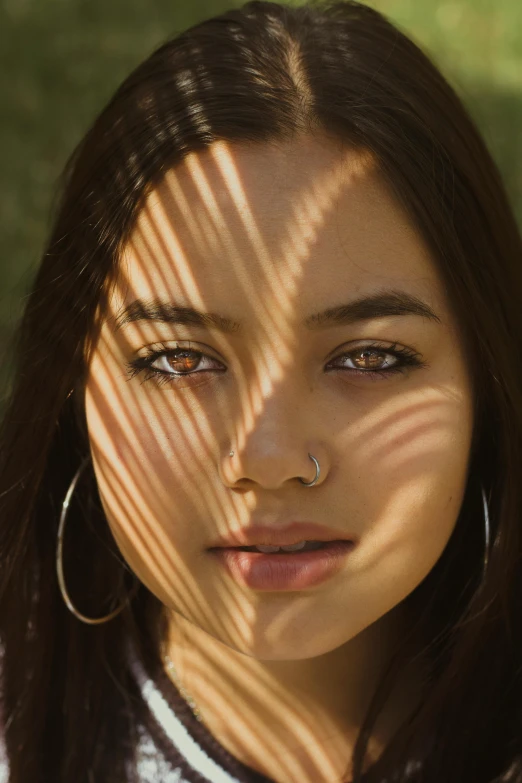 a close up of a person with long hair, diffuse natural sun lights, isabela moner, sunlight filtering through skin, south east asian with round face