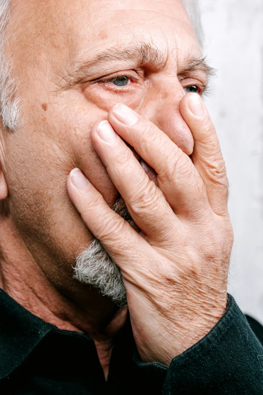 a man covers his face with his hands, inspired by Lajos Vajda, noticeable tear on the cheek, color photograph, 15081959 21121991 01012000 4k, grumpy [ old ]
