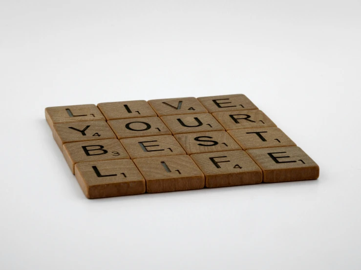 a scrabble that says i love your best life, a jigsaw puzzle, inspired by Ceferí Olivé, letterism, brown resin, denoised photorealistic render, engraved, casual game