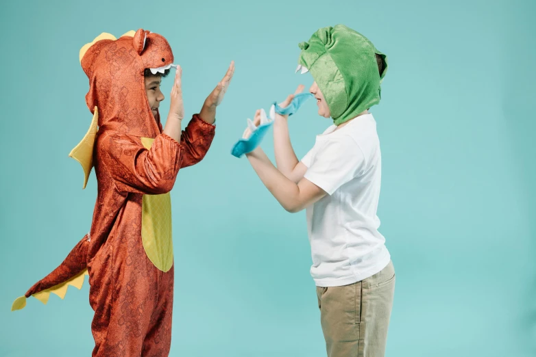 a couple of kids standing next to each other, pexels contest winner, t - rex drinking a giant ipa, dragon helmet, playing with the water, avatar image