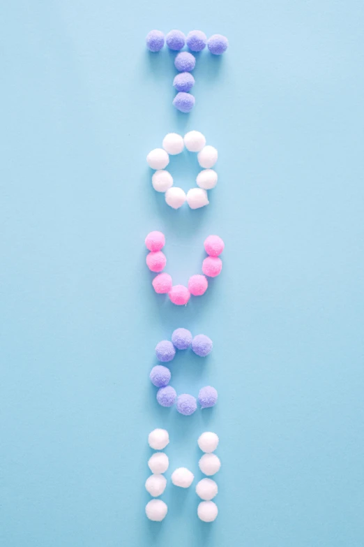 the word love spelled out of balloons on a blue background, inspired by Cerith Wyn Evans, trending on pexels, letterism, made of cotton candy, beads, mid shot portrait, banner