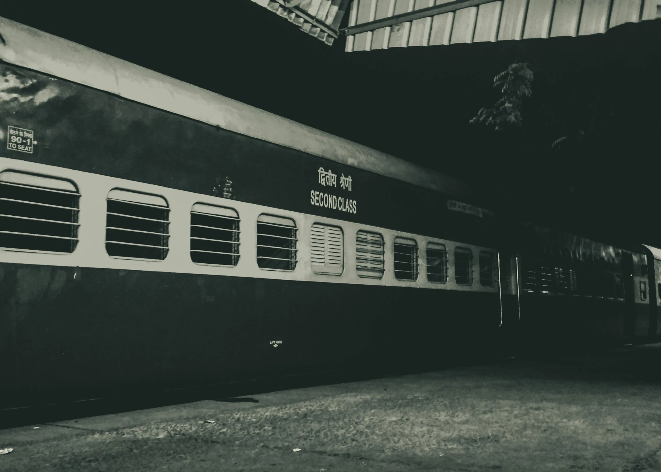 a black and white photo of a train at a station, pexels contest winner, album cover, dimly lit, instagram story, in distress