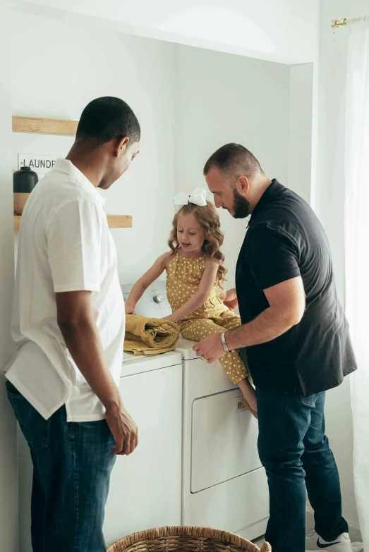 a man standing next to a little girl in a kitchen, a man, touching her clothes, with a kid, clean design