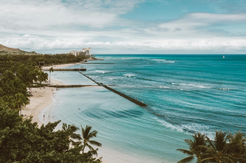 a large body of water next to a beach, pexels contest winner, waikiki beach, wide high angle view, post grunge, multiple stories