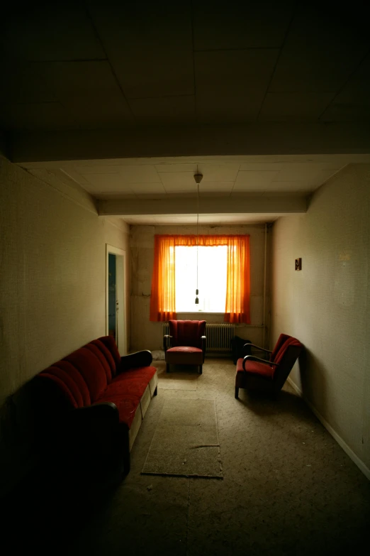 a living room filled with furniture and a window, an album cover, flickr, old abandoned building, hotel room, ( ( photograph ) ), photographed for reuters