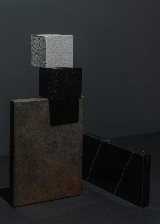 a couple of blocks sitting on top of each other, an abstract sculpture, by Harvey Quaytman, suprematism, substance designer metal, detailed product image, granite, detail shot