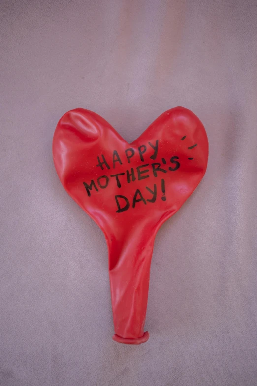 a heart shaped balloon with the words happy mother's day written on it, by Ellen Gallagher, dada, spoon placed, ca. 2001, edible, m