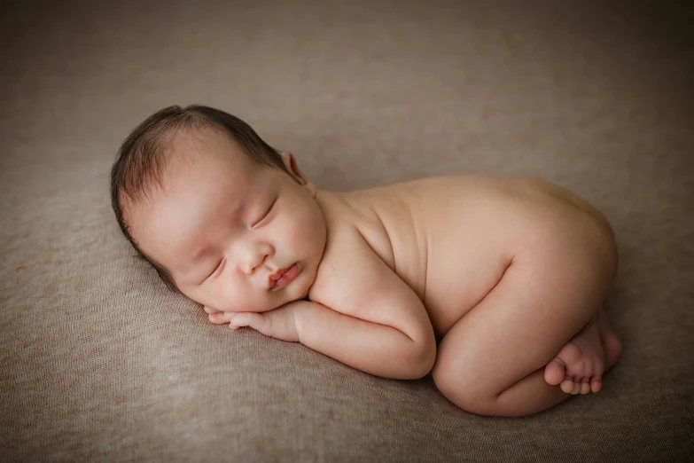 a close up of a baby sleeping on a blanket, by Ruth Simpson, shutterstock contest winner, art photography, full bodied portrait, curved body, portrait of small, elegant posed