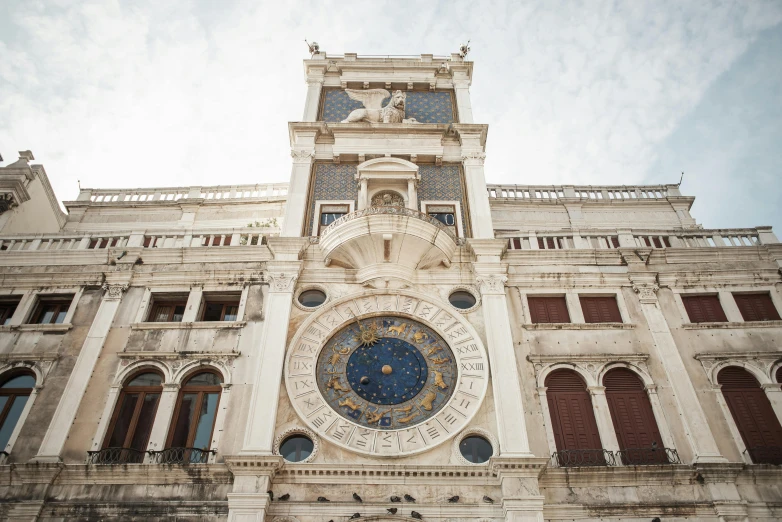 a large building with a clock on the front of it, an album cover, by Carlo Martini, pexels contest winner, baroque, indigo and venetian red, venice biennale, white, square