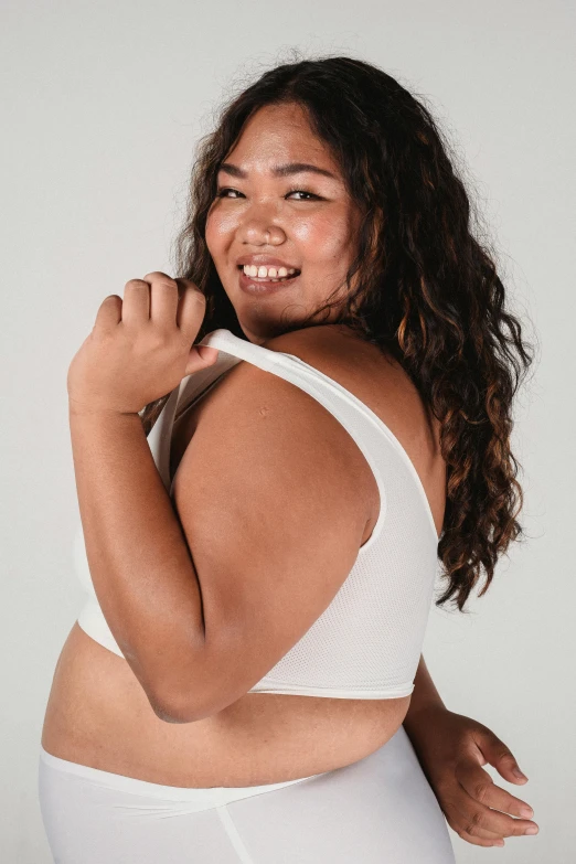 a woman in white underwear posing for a picture, wearing a cropped tops, bbwchan, smileing nright, showing her shoulder from back