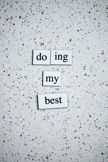 a piece of paper with the words doing my best written on it, by Robbie Trevino, trending on unsplash, made of all white ceramic tiles, magnetic, engineering, wall art