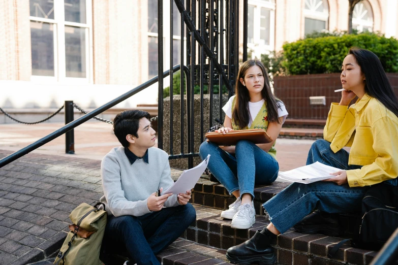 a group of people sitting on the steps of a building, pexels contest winner, academic art, lachlan bailey, studious, in a square, 15081959 21121991 01012000 4k