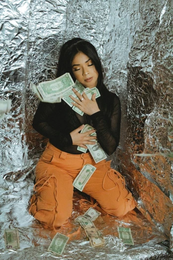 a woman sitting on top of a pile of money, an album cover, inspired by Elsa Bleda, trending on pexels, mukbang, ariel perez, icy, gongbi
