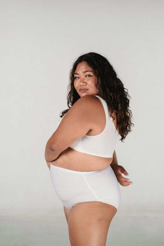 a woman in a white underwear posing for a picture, inspired by Ruth Jên, happening, overweight, wearing a cropped top, whitespace, thick linings