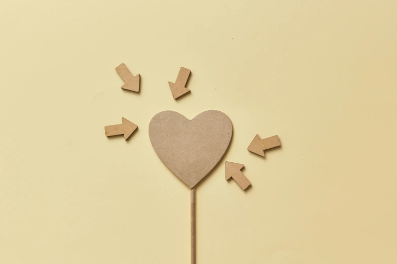a wooden heart with arrows coming out of it, trending on pexels, beige, hero prop, half - turn, diecut