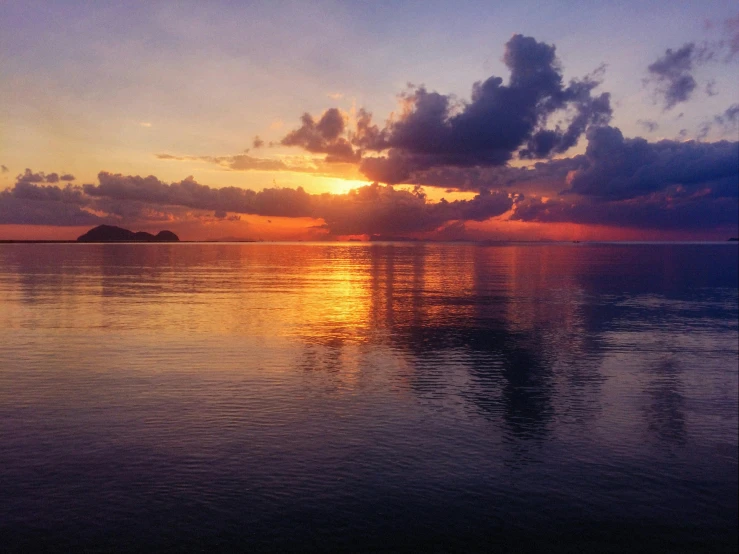 a large body of water with a sunset in the background, by Carey Morris, pexels contest winner, sumatraism, calm colors, seaview, snapchat photo, today\'s featured photograph 4k