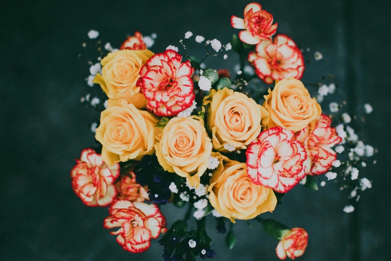 a bouquet of yellow and red carnations and baby's breath, by Carey Morris, trending on unsplash, roses and lush fern flowers, decorative roses, glossy surface, carefully crafted