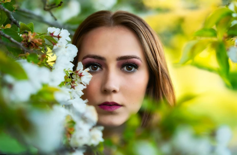 a woman standing in front of a tree with white flowers, by Julia Pishtar, pexels contest winner, close-up perfect face, attractive girl, avatar image, macro face shot