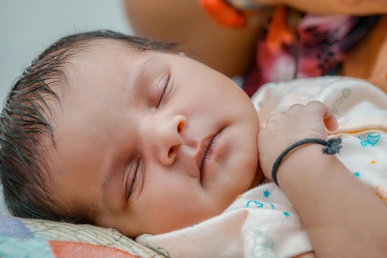 a close up of a person holding a baby, sleeping beauty, looking towards the camera, avatar image, closeup photo