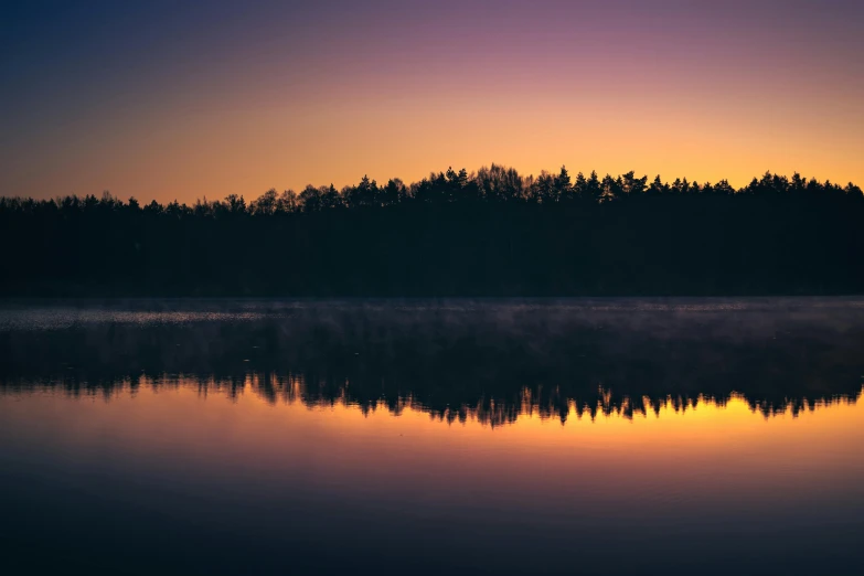 a large body of water with trees in the background, by Sebastian Spreng, pexels contest winner, tonalism, violet and yellow sunset, mirror lake, hd wallpaper, nordic forest colors