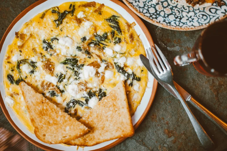 a close up of a plate of food on a table, inspired by Géza Dósa, trending on unsplash, dau-al-set, melted cheese, chuvabak, eggs, ivy's