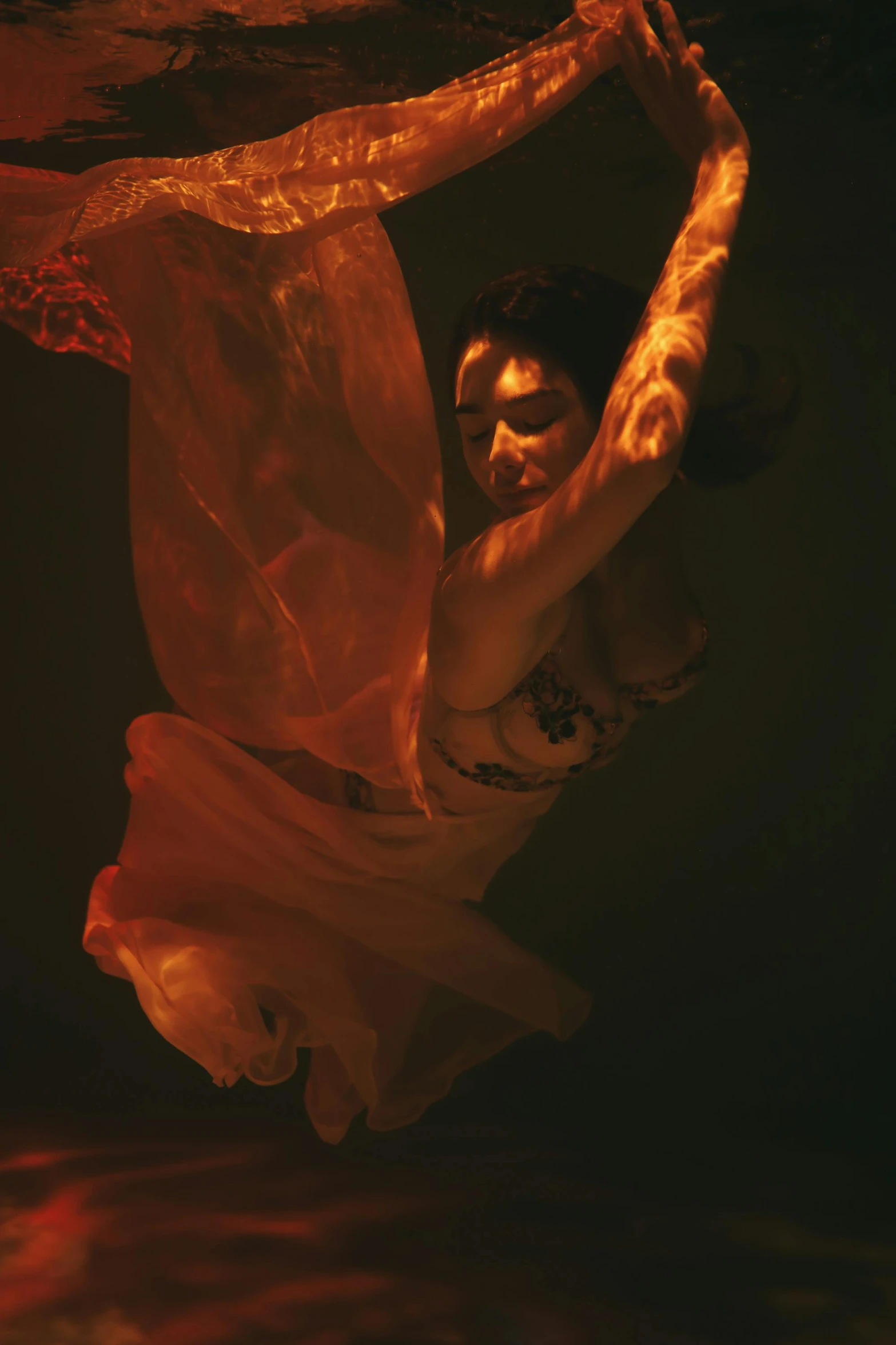 a woman in a white dress is in the water, an album cover, inspired by Roberto Ferri, unsplash, arabesque, flowing salmon-colored silk, showstudio, shot at night with studio lights, taken in the mid 2000s