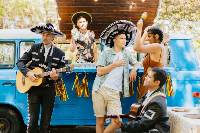 a group of people that are standing in front of a truck, pexels contest winner, renaissance, wearing sombrero, band playing, aussie baristas, avatar image