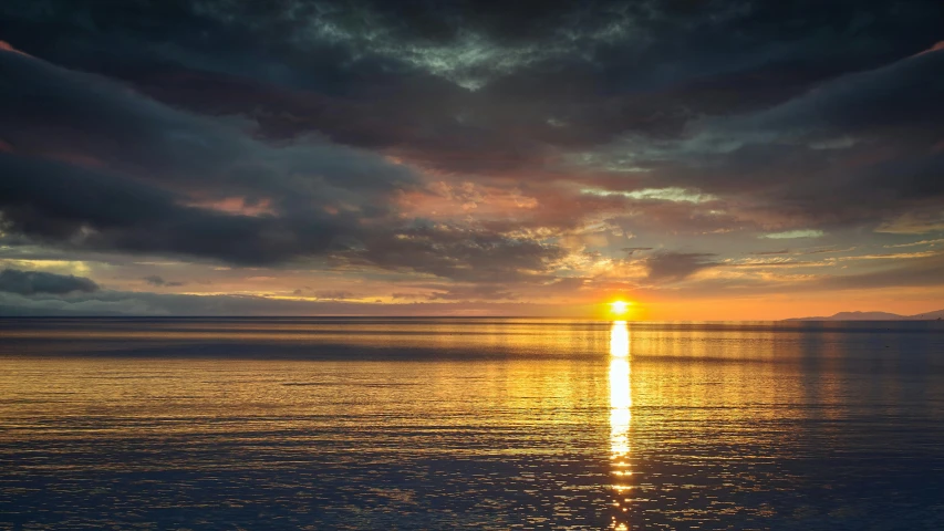 a large body of water under a cloudy sky, a picture, pexels contest winner, romanticism, golden sun, paul barson, gold, youtube thumbnail