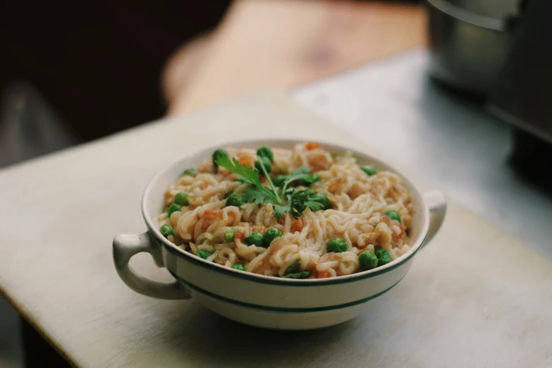 a close up of a bowl of food on a table, a digital rendering, unsplash, stringy, beige, 4l, cast