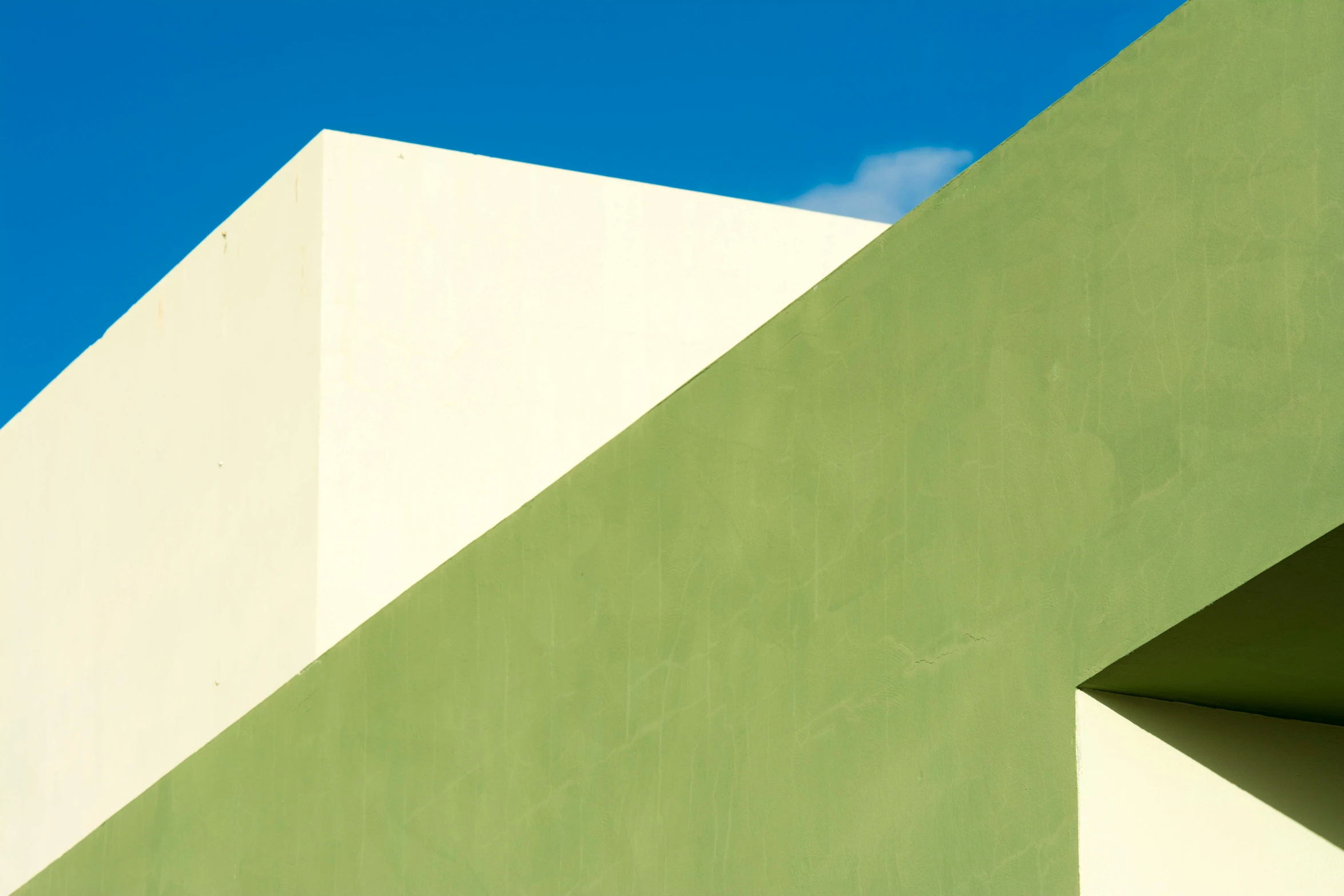 a green and white building with a blue sky in the background, a minimalist painting, inspired by Bauhaus, unsplash, minimalism, jamaican colors, ignant, contrast of light and shadows, square lines