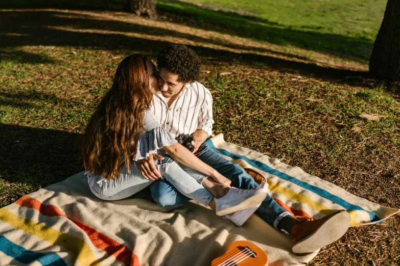 a man and a woman sitting on top of a blanket, by Carey Morris, pexels contest winner, sydney park, romantic lead, 15081959 21121991 01012000 4k, on ground