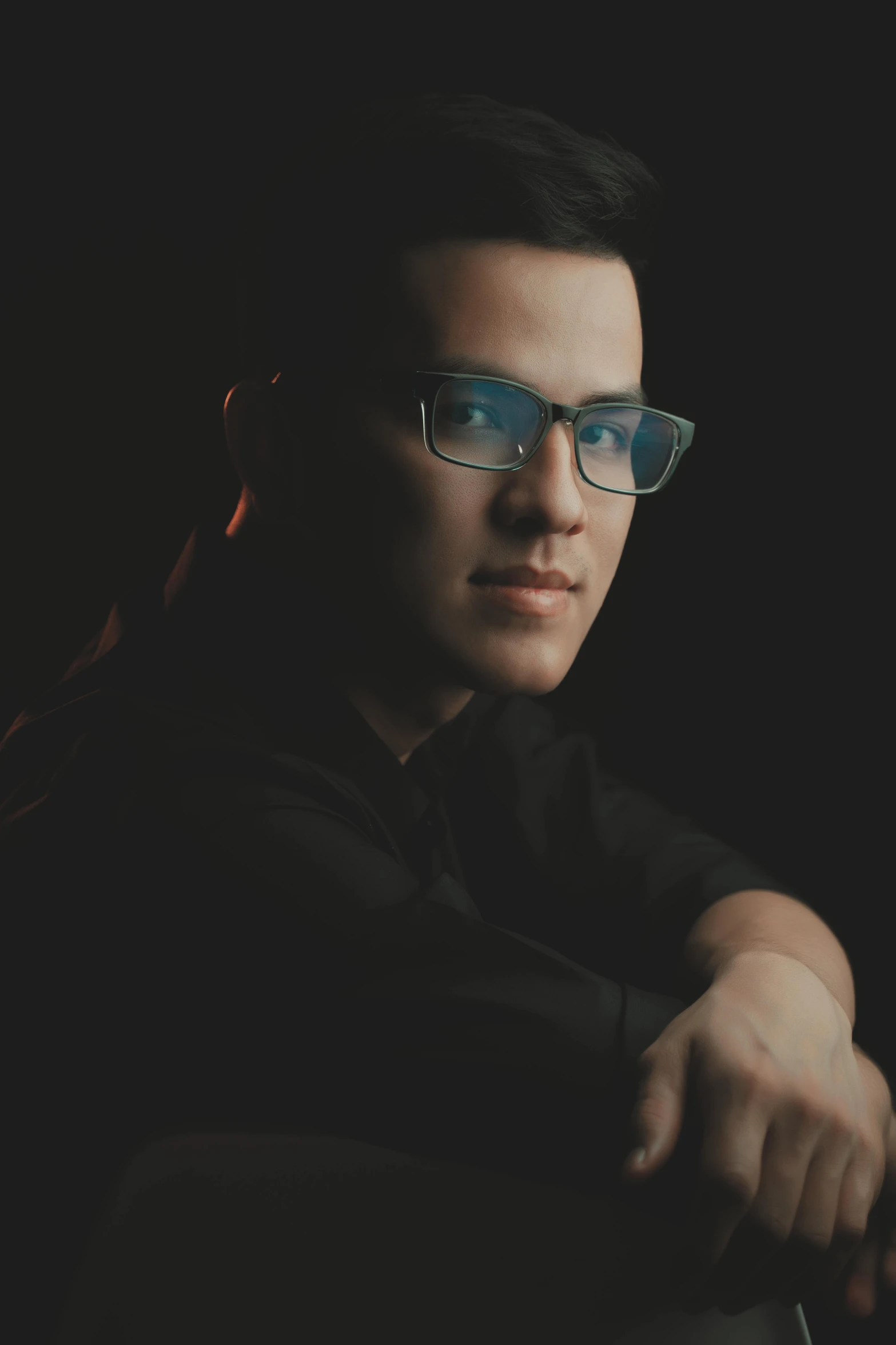 a man with glasses sitting in a chair, inspired by Izidor Kršnjavi, reddit, halfbody headshot, postprocessed), **cinematic, with square glasses