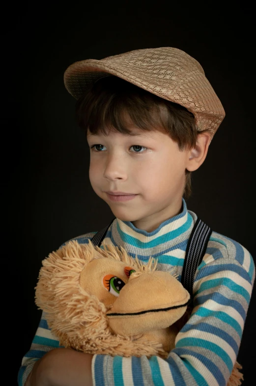 a young boy holding a stuffed animal in his arms, a character portrait, inspired by George Barker, taken with sony alpha 9, breton cap, puppets, portait image