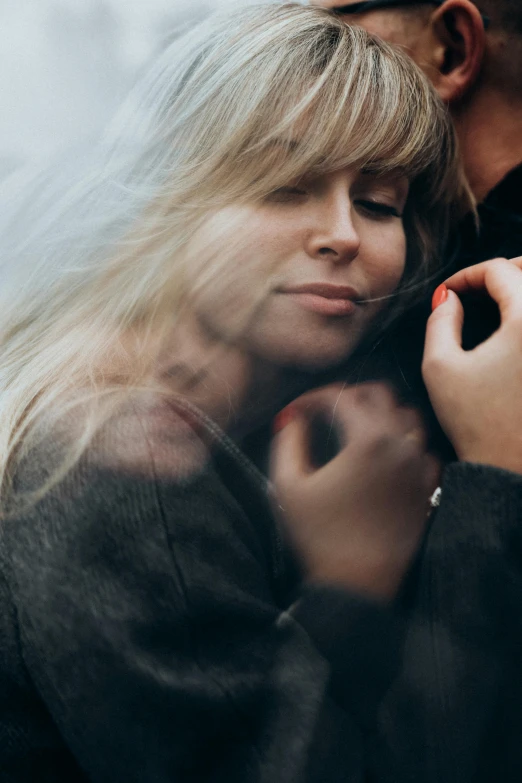 a man and a woman standing next to each other, trending on pexels, romanticism, hugging and cradling, close up of a blonde woman, swirling around, 15081959 21121991 01012000 4k