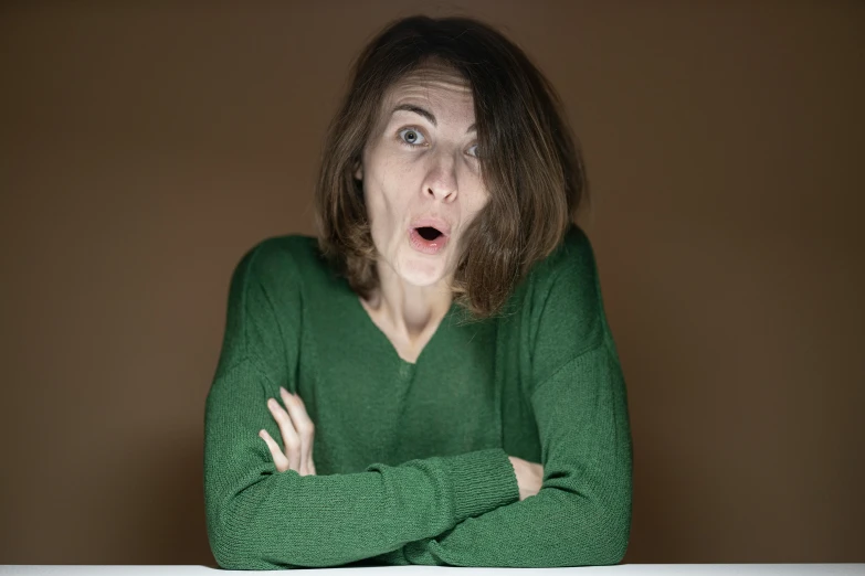 a woman with a surprised look on her face, pexels contest winner, green and brown clothes, nervous and terrified, mid - 3 0 s, drunk woman