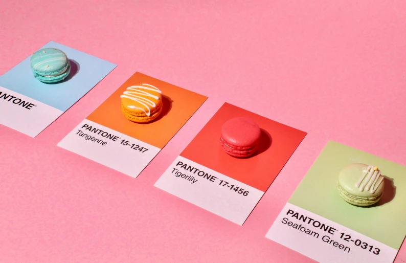 a set of four pantone cards with macarons on them, inspired by Russell Dongjun Lu, trending on pexels, color field, gradient light red, colored neons, opening shot, vibrant: 0.75