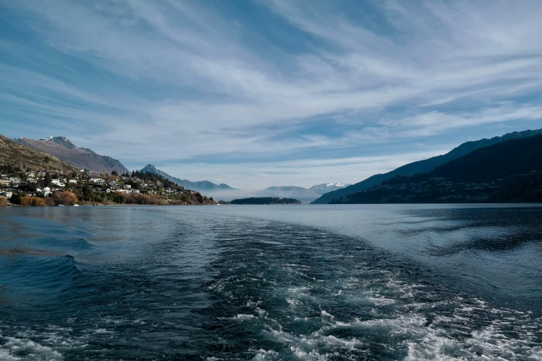 a large body of water with mountains in the background, by Peter Churcher, pexels contest winner, visual art, picton blue, conde nast traveler photo, currents, switzerland