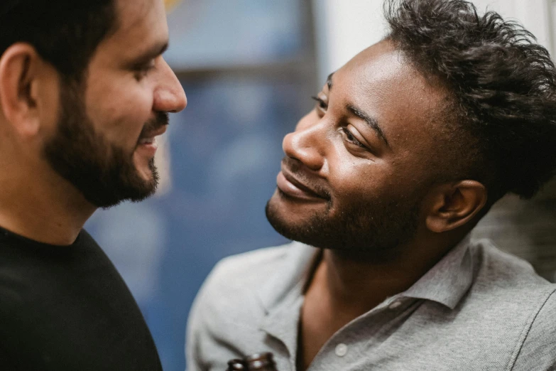 a couple of men standing next to each other, pexels contest winner, renaissance, smiling at each other, diverse, beard stubble, kissing together cutely