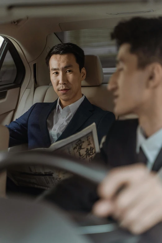 two men sitting in the driver's seat of a car, inspired by Ding Yunpeng, corporate style, ad image, multiple stories, thumbnail