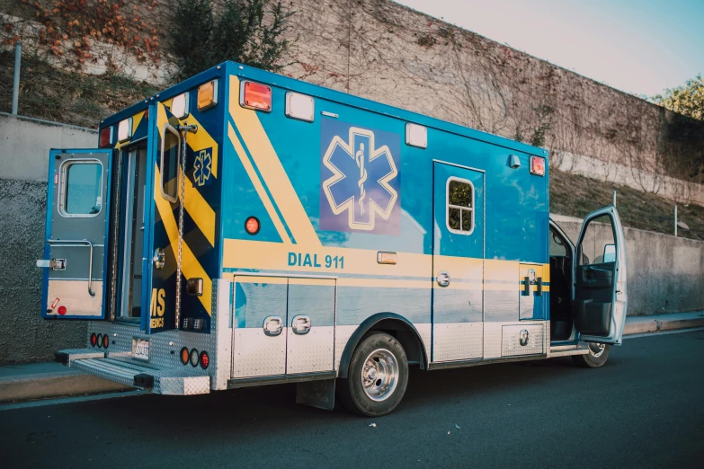 an ambulance is parked on the side of the road, by Meredith Dillman, pexels, blue, profile picture 1024px, multiple stories, hazmat