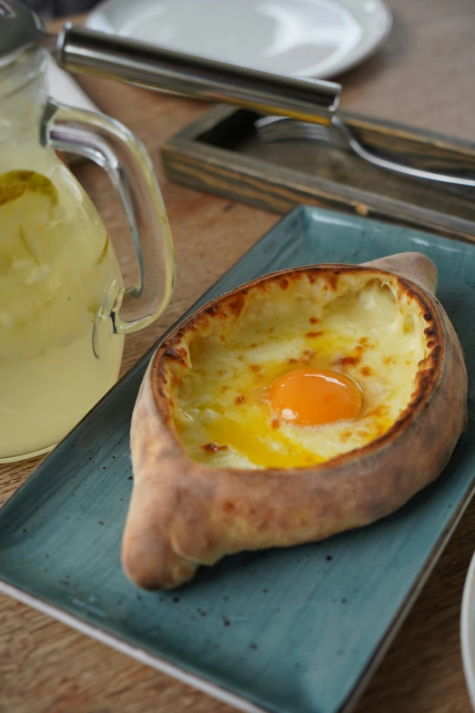 a close up of a plate of food on a table, inspired by Géza Dósa, hurufiyya, vin diesel head in egg cup, patagonian, rustic, calzone zone