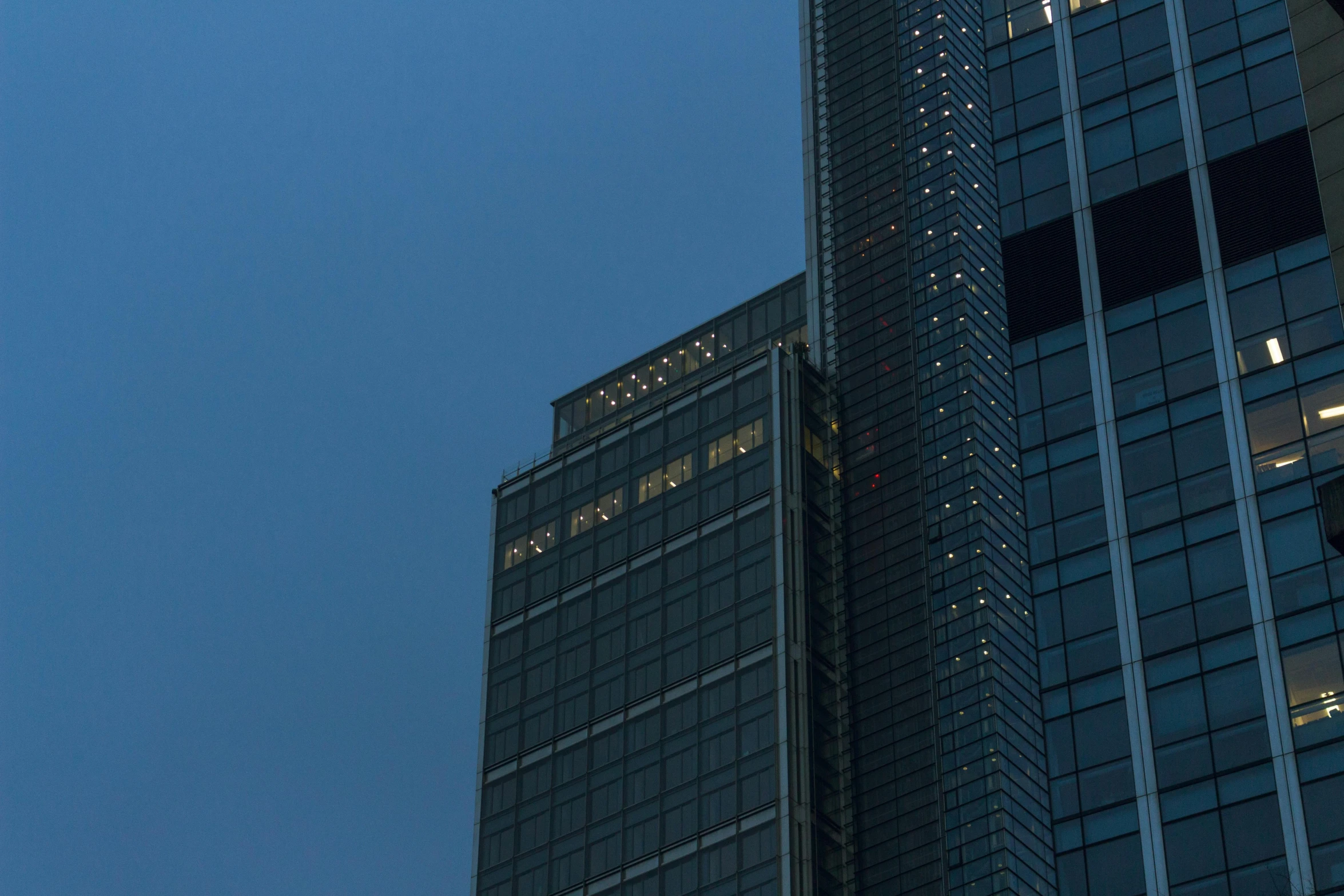 a couple of tall buildings sitting next to each other, inspired by Cheng Jiasui, unsplash contest winner, hurufiyya, commercial lighting, rectangle, tokujin yoshioka, exterior photo